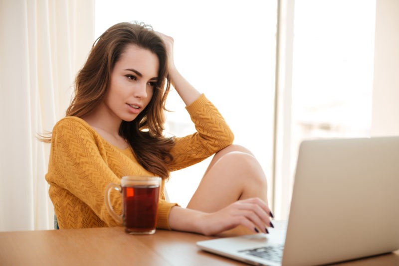 woman looking at laptop best ways to optimize for seo